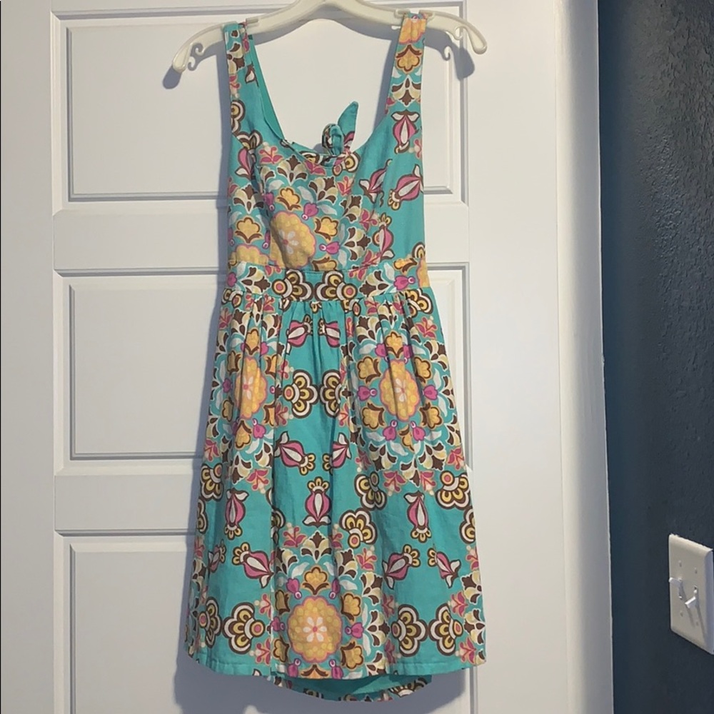 Turquoise pattern mini dress with cutout back